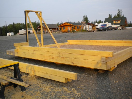 The floor and door are framed and the logs are going up.