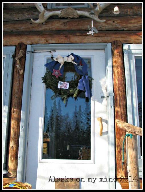 The cabin door and wreath.