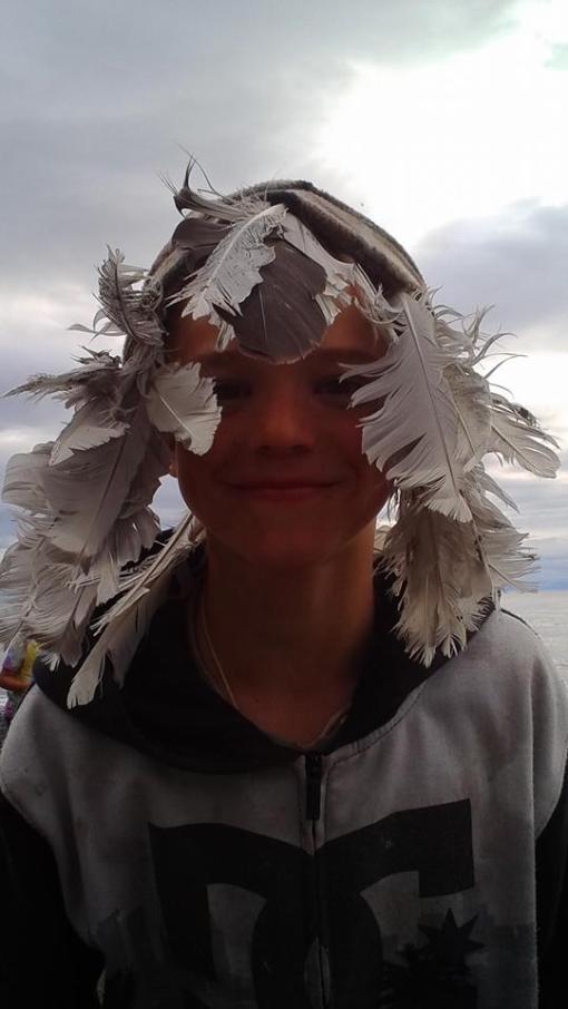 Photo credit: Brandi W. Feather collecting child.