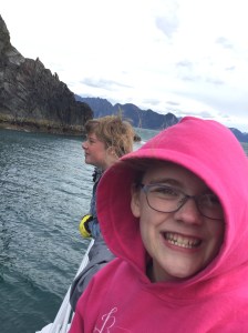 Cheesy smile, before she lost the glasses.