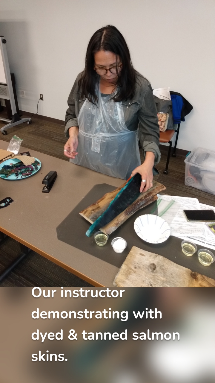 Our instructor demonstrating with dyed & tanned salmon skins.